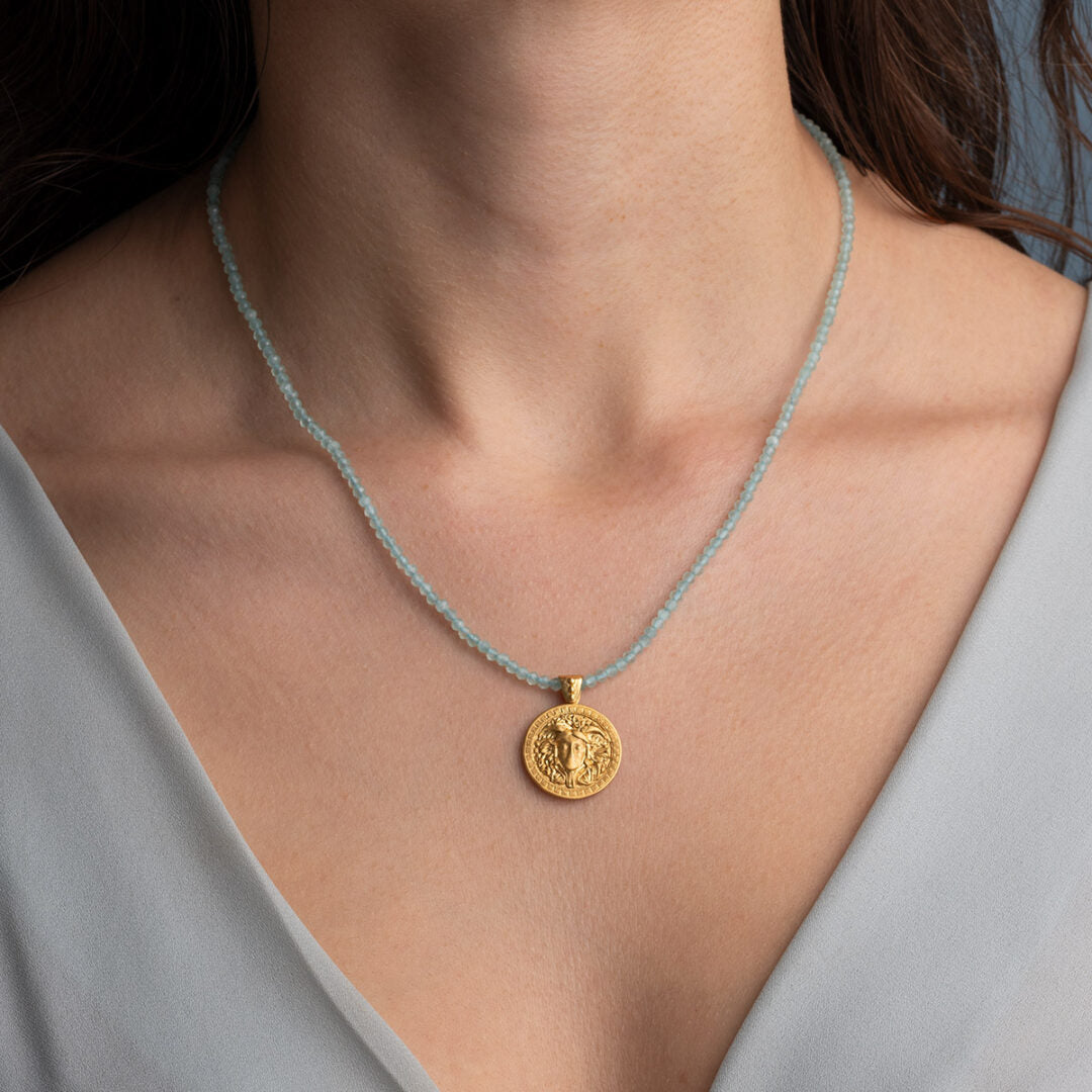 Stone string necklace with Medusa pendant