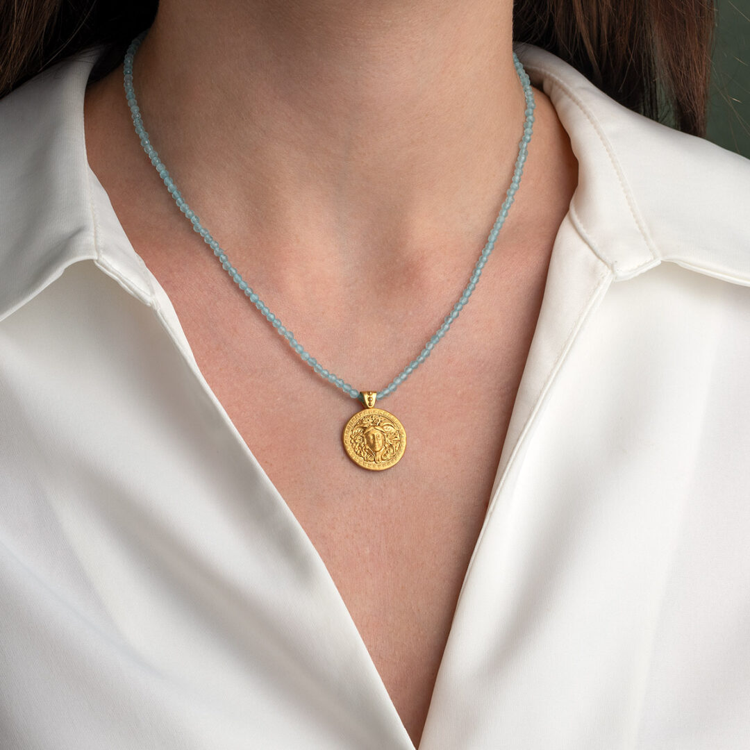 Stone string necklace with Medusa pendant